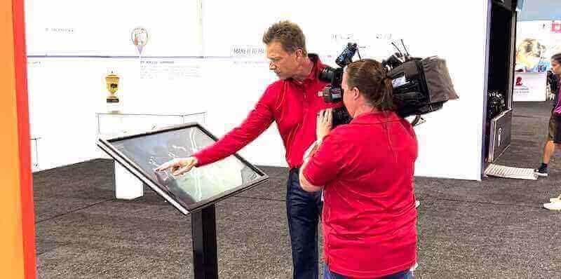 Professional demonstrating interactive display technology Display technology demonstration