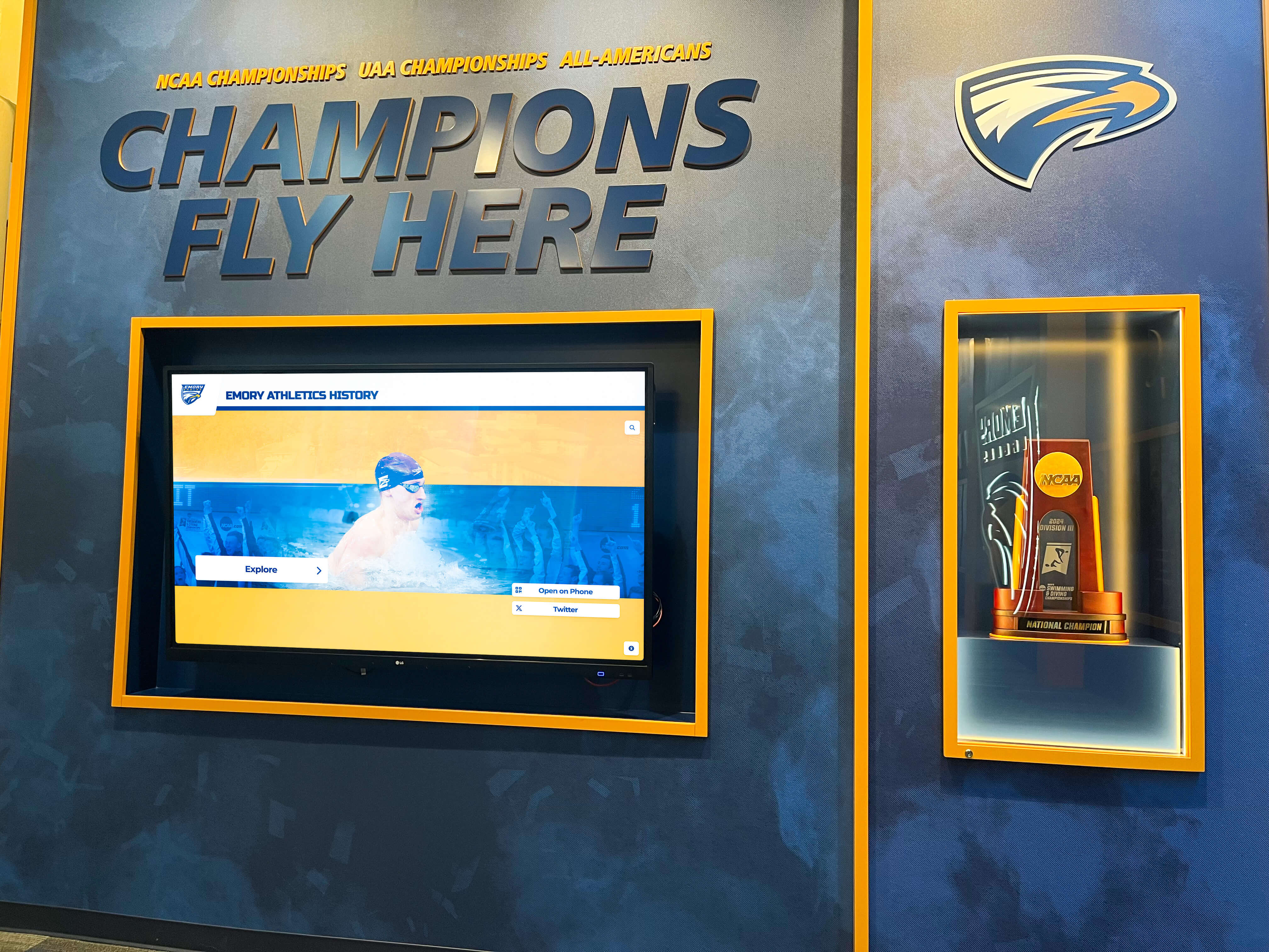 Comprehensive championship wall featuring trophies and recognition State championships trophy display