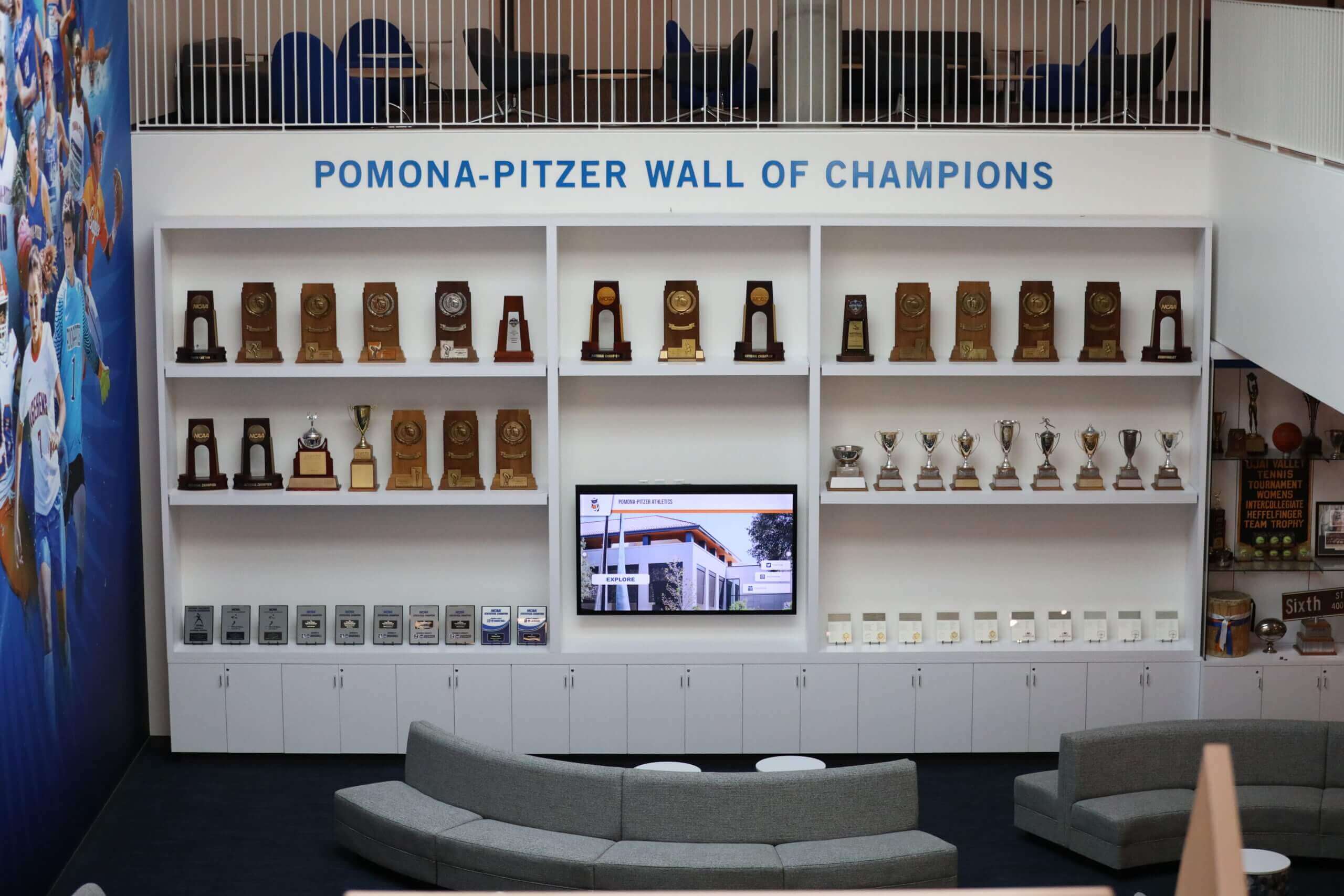 Dedicated championship lounge featuring trophy displays and seating area Trophy lounge display